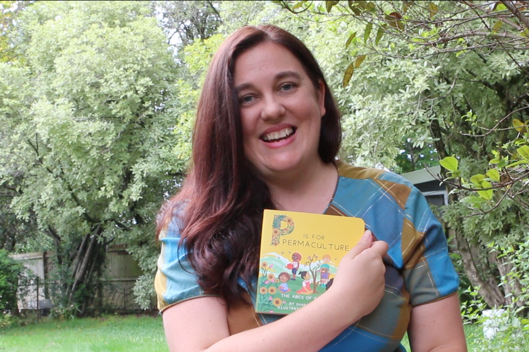 Author Sharon Baldwin with her book "P is for Permaculture"